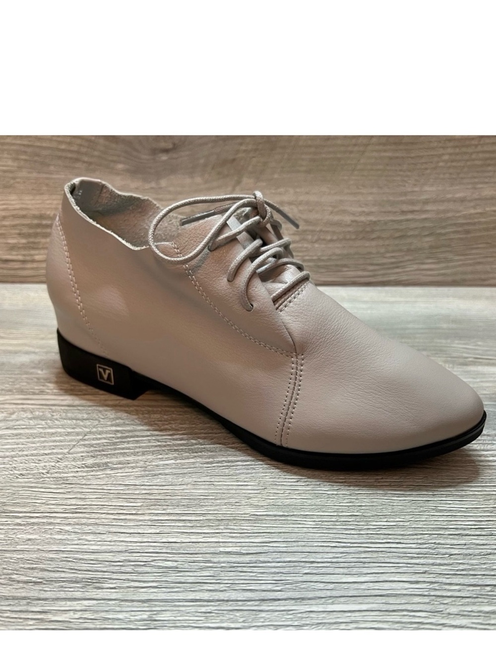 Super soft cream leather lace up ankle boots. Small heel and wedge